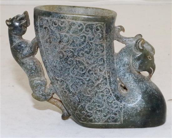 A Chinese archaistic green bowenite jade phoenix rhyton,